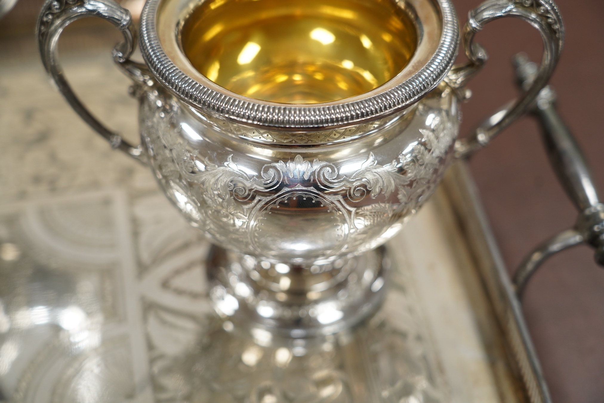 A Victorian four piece plated teaset and a tray. CITES Submission reference 6R2FT6J1. Condition - good